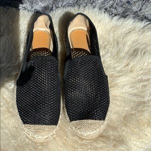Black Espadrille slide ons.
